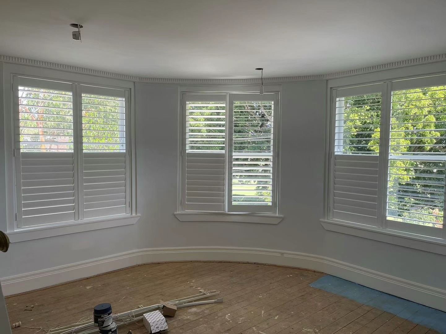 Plantation shutters, bay window